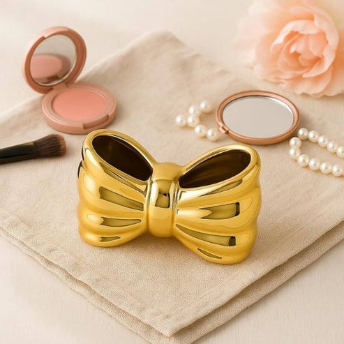 Bow shaped makeup brush holder