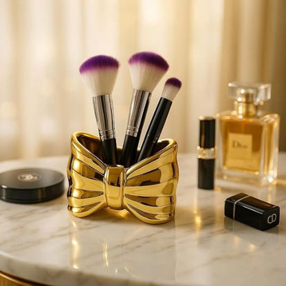 Bow shaped makeup brush holder